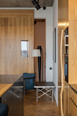 Living room with wooden table, chairs, lamp and hardwood flooring