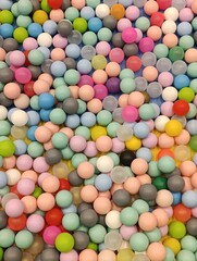 a close up of a colorful plastic ball with a colorful top. Children's playground