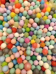 a close up of a colorful plastic ball with a colorful top. Children's playground