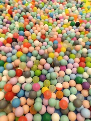 a close up of a colorful plastic ball with a colorful top. Children's playground