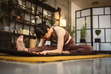 Fototapeta na wymiar Japanese mature woman practice yoga at home