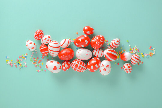 Easter eggs in red and white tones on a blue background. Happy Easter, a place to copy. Flat layout, top view. Easter love. valentine's day