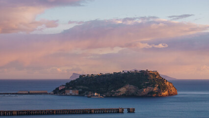 Golden sunset over the sea at the coast of Gulf of Naples at Campi Flegrei with island, Pozzuoli,...
