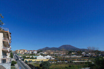 Mount Vesuvius seen from Ercolano city with clear blue sky on a sunny day, Naples, Campania, Italy
