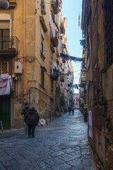 Typical townscape of dark narrow streets and alleys in the city of Naples, Campania, Italy
