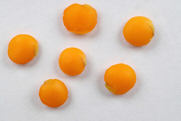 Red lentils levitate on a white background. Close up red lentil. macro.