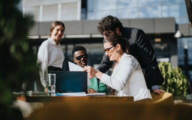Diverse group of business associates engaging in strategic discussions at an outdoor cafe setting, exemplifying teamwork and collaboration.