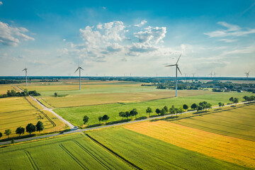 Wind turbines on fields in summer, view from above