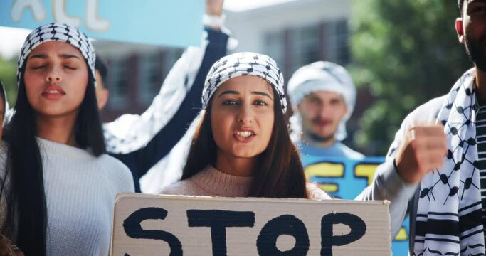 Protest, war and woman with sign to stop genocide for justice and crowd with support of Palestine. Angry, speech and rally for freedom with group of people to call attention to conflict for change