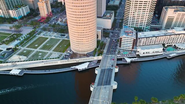 Contemporary skyscraper buildings, street traffic and pedestrian riverwalk in downtown district of Tampa city in Florida, USA. American megapolis with business financial district