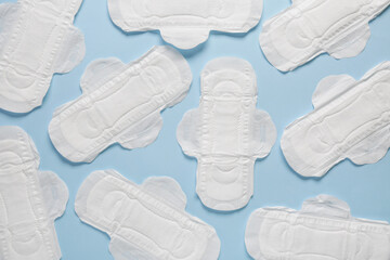 Menstrual pads on blue background © Pixel-Shot