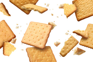 Tasty dry crackers falling on white background