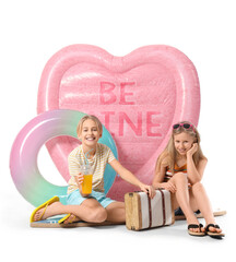Cute little kids with inflatable mattress, ring, suitcase and cocktail on white background