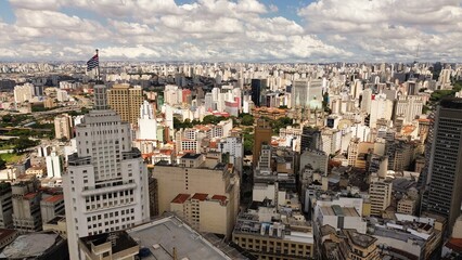 The image captures the vibrant downtown area of São Paulo, with its tall skyscrapers, bustling...