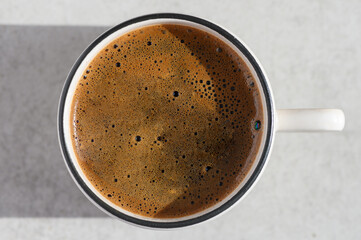 Top view traditional cup of Turkish coffee on an abstract background.