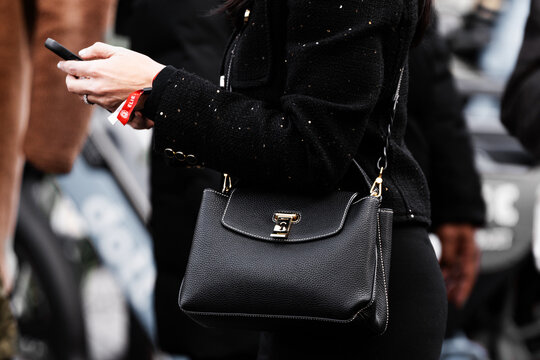 Milan, Italy - January, 15, 2024: woman wears Bally black bag, street style details, fashion outfit detail