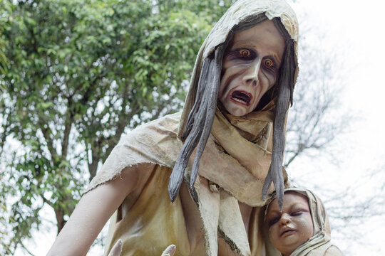 Sculpture of ¨la llorona¨ with her baby in the park of Myths and Legends in the Cafam vacation center, Melgar-Tolima. Concept of terror and oral tradition of Latin America.