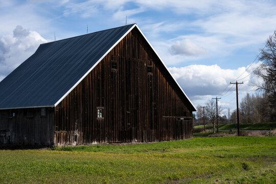 Rustic wood barn in rural America, agricultural background landscape
