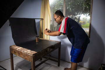 Asian men doing product photos