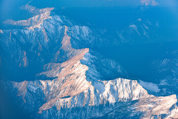 Aerial view of snow capped mountains in Sichuan and Tibet, China - obrazy, fototapety, plakaty