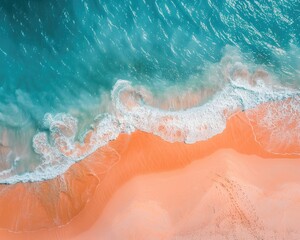 Fototapeta premium Aerial view of a beach where the orange sand meets the azure sea