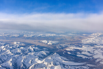 Naklejka premium Aerial view of snow capped mountains in Sichuan and Tibet, China