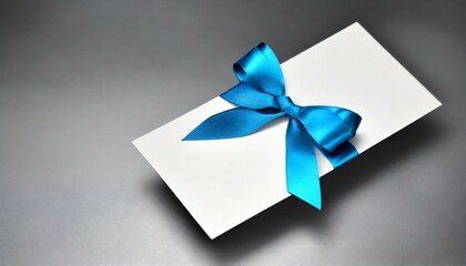 gift box with card,  blue gift card with a vibrant black ribbon bow right side, a minimalist grey background with subtle shadowing.