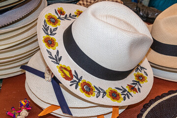 A handmade straw Panama hat, a Paja Toquilla hat or a sombrero with embroidered flowers on....