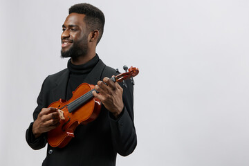 Talented African American musician playing the violin beautifully on a white background