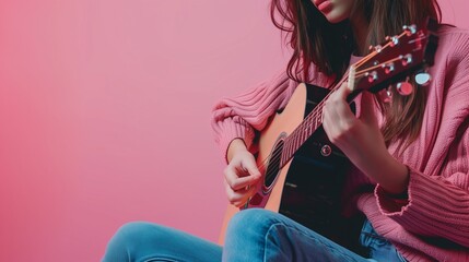 Young female playing guitar accoustic instrument musical melody