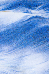 Obraz premium Closeup dust of pigment sparkling with blue fluid color，Abstract mountain background