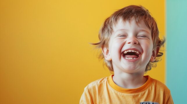 A little boy smile laughing happiness wearing yellow t shirt isolate color background