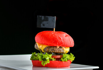 Red Bun Beef patty Burger, mixture of special spices and homemade pickled jalapeno with lettuce and melting cheese