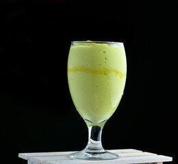Avocado thick milk shake juice in a glass
