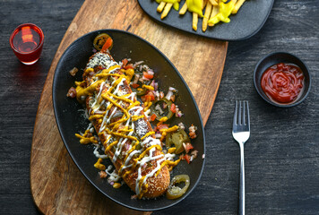 Grilled Beef Sausage sandwich, Homemade yellow and white Sauce, Mix Bell Pepper, Cheddar Cheese And Baked.