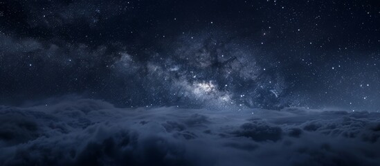 The night sky is filled with twinkling stars and fluffy clouds, creating a serene and beautiful scene