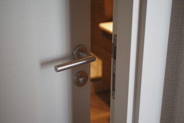  gray bathroom door slightly open .