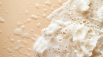 Obraz na płótnie Canvas spot of shampoo foam on a beige background. top view. studio photoshoot with high quality lighting