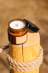 Scented candles on a wooden pole 