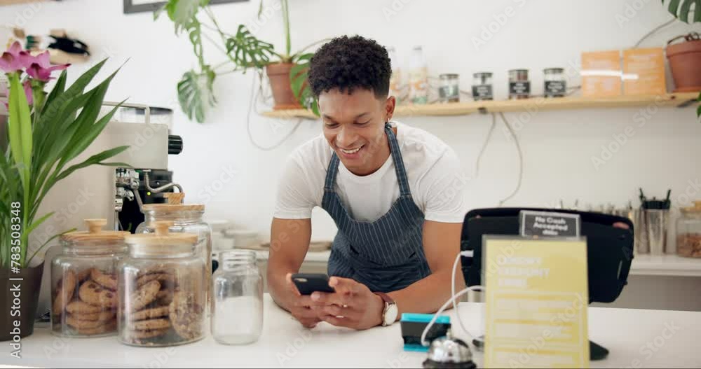 Wall mural Man, cafe and barista with smile at phone for ecommerce, networking and communication at counter. Male person, small business and waiter with technology for online sale, funny discussion and service