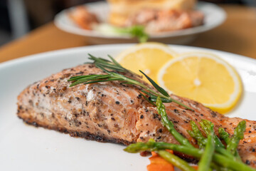 Close up, Salmon Steak with Butter Toast Ready to eat on a wooden table.