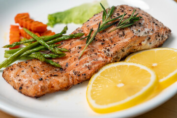 Close up, Salmon Steak with Butter Toast Ready to eat on a wooden table.