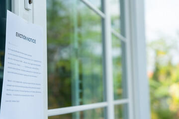 document with the text eviction notice, Civil servant sticks a notice of eviction of the tenants...