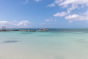 Fotobehang surfside beach lagoon and boat dock Aruba © Hans