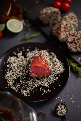 piece of tuna fillet covered with sesame seeds before cooking