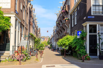 Amsterdam, Netherlands - June 30, 2019: The historic city center of Amsterdam in the morning....