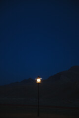 a lamp standing on the road