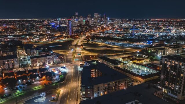Flying toward the city skyline at night, aerial hyperlapse, Denver, Colorado, 4K