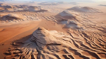 Deurstickers Aerial view of sandstone formations in a desert, with textured patterns carved by wind and water erosion over millennia © Qadeer
