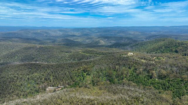 Drone aerial photograph of a large hilly valley full of lush foliage near Mount Wilson in the Blue Mountains in New South Wales in Australia